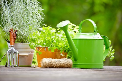 Gardener preparing soil for planting in Poplar